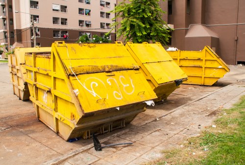 Commercial recycling containers and staff organizing bins in Bromley